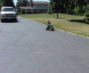 Nancy's drive was a big hit.  The boys raced down the drive most of the afternoon.  Nancy picked up several ride-on's at garage sales for the little guys.