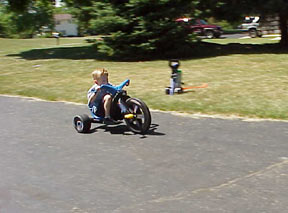 Tyler zooming down the drive.